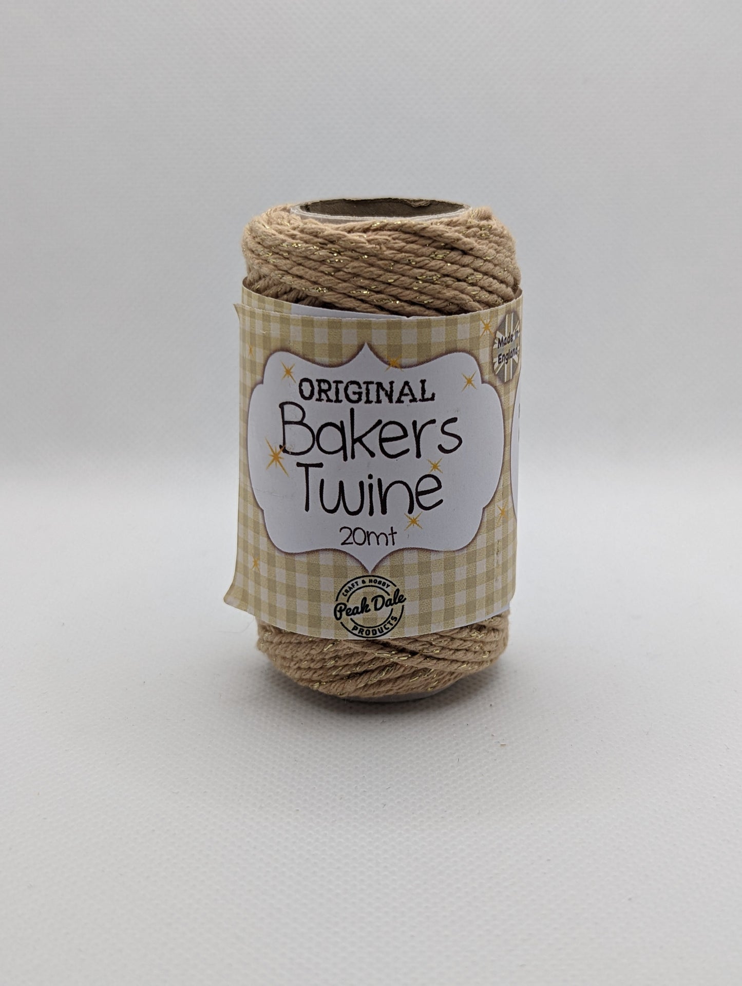 Image of the front of a roll of 20m Bakers Twine. The colour is a beige with gold Shiny parts running through it. Great for wrapping packages and presents/ gifts.