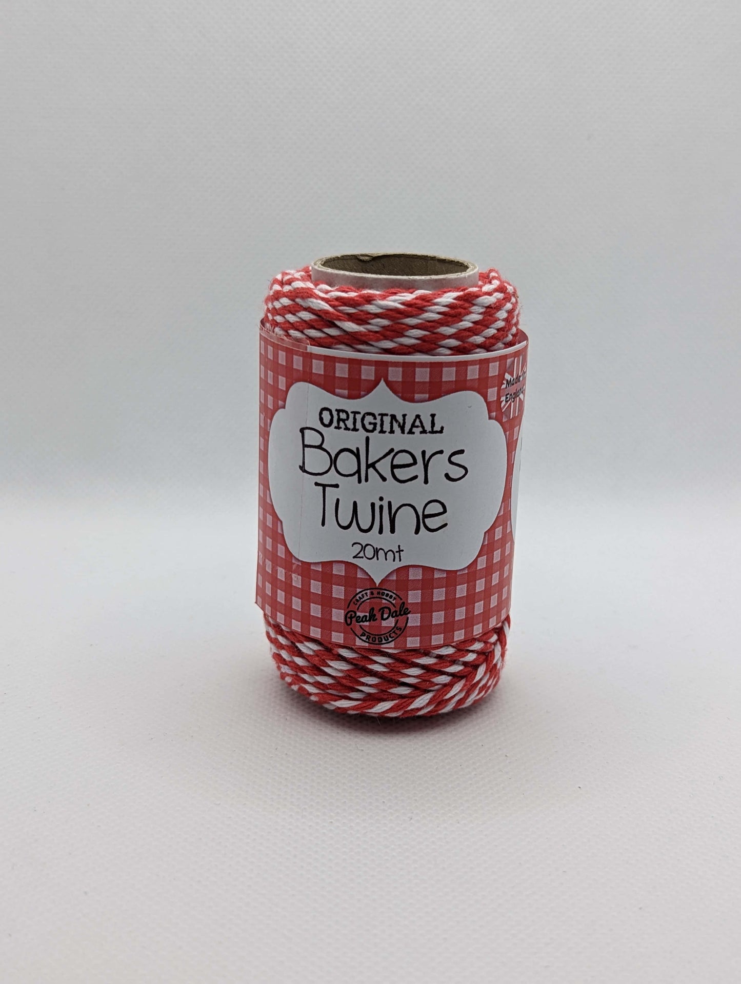 Image of the front of a roll of 20m Bakers Twine. The colour is Red and white stripes. Great for wrapping packages and presents/ gifts.