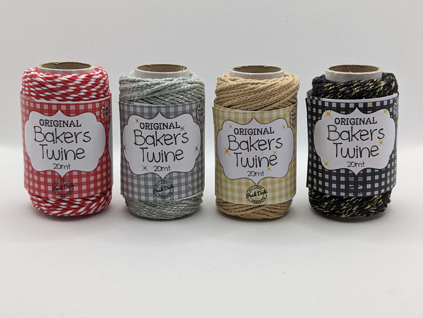 Image of 4 rolls of 20m Bakers Twine in different colours. Traditional Red and White, Silver, Gold and a Shiny Black. Great for wrapping packages and presents/ gifts.
