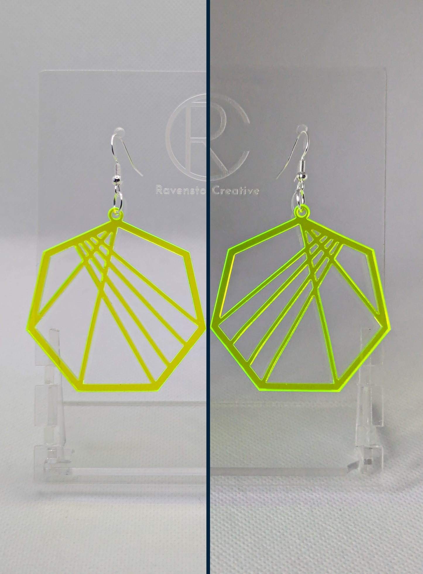 Shows a pair of earrings that have silver ear wire hook fixings. They are Geometric Heptagons with lines crisscrossing through the middle. They are made from Neon Green Acrylic and are against a white background and shows how they glow in dim light.