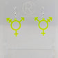 A pair of acrylic earrings in the shape of the Pride Transgender LGBTQ symbol. They have Silver ear wire hook fixings and the colour is Neon Green.  They are on a clear stand with the Ravenstor Creative Logo on it against a white background.